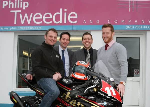 Stephen Thompson pictured with David McCombe (Associate Partner), Marty McAuley (Associate Partner), and Craig Wallace (Associate Partner) outside Philip Tweedie and Companys Coleraine store.