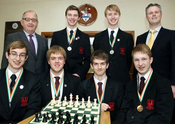 The Ballymena Academy Chess team made up of Chris Petticrew (captain), Eoin McCorkindale (vice-captain), Johnny Moore, Calvyn Smyth, Lochlann Allison and Jonny Wilson photographed with Mr Ronnie Hassard (principal) and teacher Patrick Scullion after winning the Ulster U-19 chess tournament in Galway. INBT 21-803H