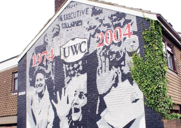 The 30th anniversary of the 1974 collapse of the nascent Sunningdale Executive is celebrated in this large artwork in Lincoln Courts. The resignation of the power-sharing Executive was brought about by the opposition of the Ulster Workers' Council (UWC) and accompanying general strike and street protests. By Attitude Artwork, 2004.