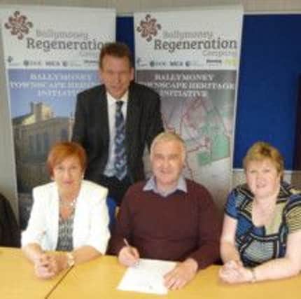 Left to right: Winifred Mellett, Chairperson, Ballymoney Regeneration Company; Nick Brown, THI Project Manager (standing), Roy Shiels, Anne Shiels. INBM21-14
