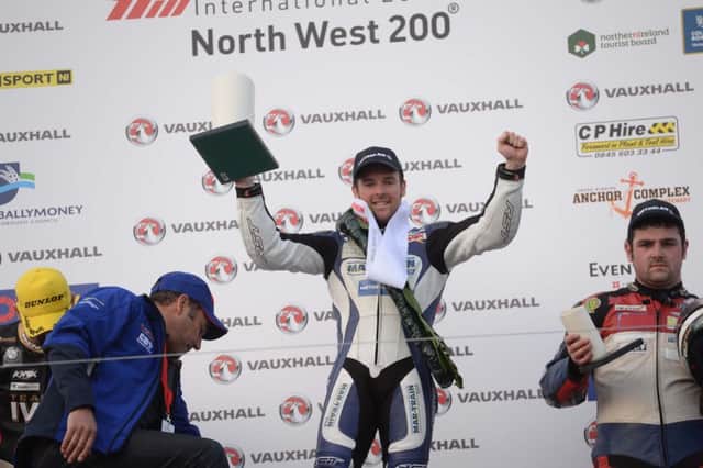 Alastair Seeley celebrates winning the superstock race, his second win of the evening during this evenings races at the 2014 Vauxhall International North West 200 on the North Coast.
 Photo Stephen Davison/Pacemaker