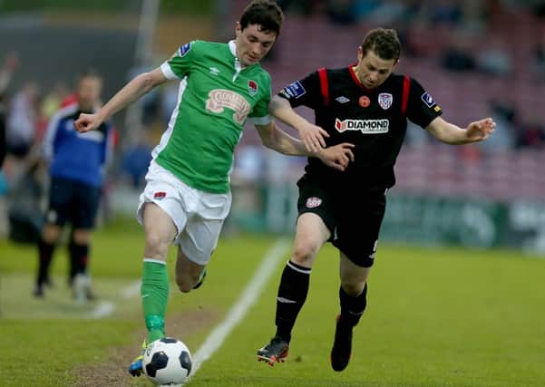 Cork City's Brian Lenihan tries to get away from Derry City midfielder Danny Ventre. Picture by Donall Farmer/INPHO