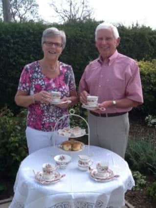 Betty and Bill Lutton preparing for the vintage tea party