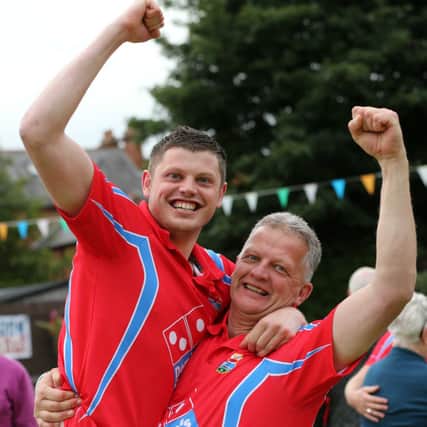 Coleraine captain Jordan Dallas and his dad Victor celebrate their team's win over Ballymoney in last year's final of the IBA Senior Cup at Belmont Bowling Club. John McIlwaine/Press Eye