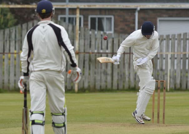 Eglinton's Craig Averill deals with this 'bouncer' from Brigade bowler Johnny Thompson. INLS2014-119KM