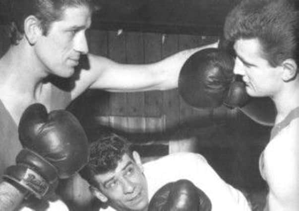 Training in Banbridge Bosco about 1965. Bobby Peden on the left facing Eamon McCusker with long serving Banbridge ABC coach, Barney Savage keeping an eye on both boys. Barney Savage was an exceptional coach. He coached Bobby Peden to two Ulster Senior Titles. The first in 1967 when Bobby outboxed Hugo Gillhouley of Immaculata and the second in 1968 when Bobby took a middleweight title against Mick Regen from the Belfast Bosco gym.