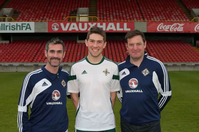 Stephen Collins pictured with Keith Gillespie and Gerry Taggart.