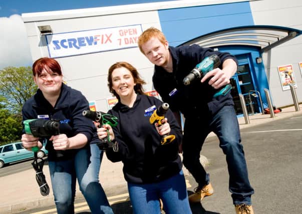 Kirsty Edwards, Aoibheann Seeley and Chris Donnelly outside the new Screwfix store in Lurgan.