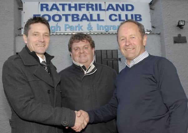 Rathfriland Football Club Chairman, Howard Murray, welcomes Dessie Gorman, a former player with clubs including Linfield, Derry City, Dundalk and Arsenal FC. Dessie, will take on the role of assistant manager with Rathfriland Rangers, during the incoming 2014-15 season. Looking on is team manager John Kernaghan.  © Photo: Gary Gardiner. IN BL WK 2114-502.
