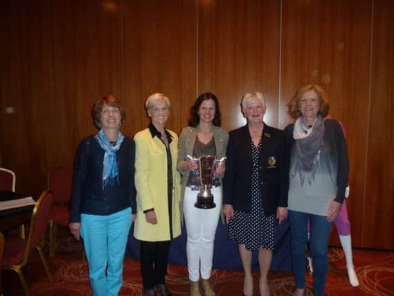 Lady Captain Rosie Millar pictured with the Aveline England winners.