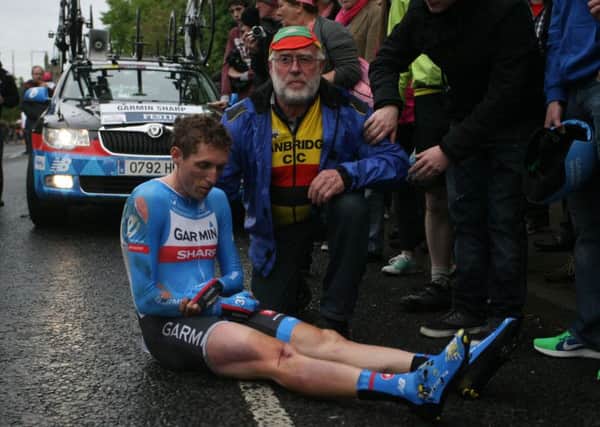 PACEMAKER BELFAST  09/05/2014 Irish rider Dan Martin crashed out of the Giro this evening after a crash on the lower Newtownards Road during the team time trial. He was taken immediately to a nearby hospital where he is being treated for a suspected broken shoulder.
Photo Darren Crawford/Pacemaker Press