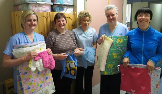 Carrickfergus Garden Society has made another presentation of items as part of the Antrim Hospital Neonatal Unit Appeal. Pictured, from left to right, are Dionne Sloan, Linda Thompson, Nicola McCall, clinical sister Elizabeth Osborne and Bernie McCreanor. INCT 21-799-CON