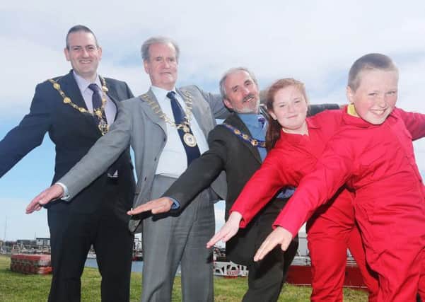 ©/Lorcan Doherty Photography - 16th May 2014.
Red Arrows at the ready: The world-famous Red Arrows will perform their thrilling flying display at the 2014 LegenDerry Maritime Festival as the stunning send-off to the Clipper 2013-14 Round the World Yacht Race on Sunday 29th June 2014.
Brought to the North West by a partnership between Donegal County Council, Limavady Borough Council and Derry City Council, the distinctive red jets, which are this year celebrating their 50th display season, will execute their dynamic aerobatic display at the mouth of the River Foyle between Greencastle in Co. Donegal and Magilligan/Binevenagh in Co. Londonderry.
Demonstrating their aerial manoeuvres to announce that Red Arrows are Mayor of Donegal, Ian McGarvey; Mayor of Derry, Martin Reilly and Mayor of Limavady, Gerry Mullan alongside local school children Fiona McLaughlin and John Lynch kitted out in the red flying suits.
For information visit: www.legenderrymaritimefestival.com or www.clipperroundtheworld.com.
Photo