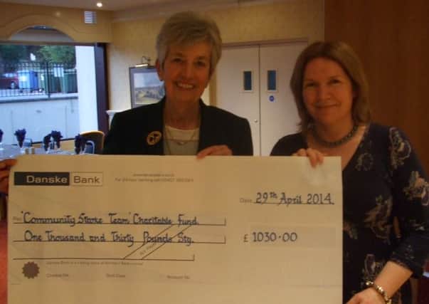 The Lady Captain Mrs Gil Colvin presenting a cheque to Sharon Murphy from the Lisburn Community Stroke Team.