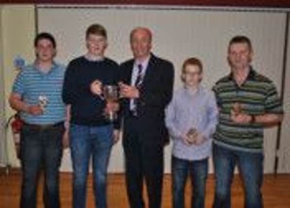 Division 2 winners, Foyle Badminton team receive their trophy from North West Badminton League Chairman, Allan Young at the annual presentation night at Bready Cricket Club. From left to right are, Mervyn Magee, Adam Lowry, Allan Young (Chairman), Kyle Magee and George Chapman.