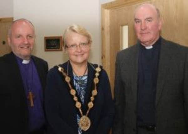 The Bishop of Connor, the Rt Rev Alan Abernethy, and the rector of St Hildas, the Rev David Boyland, welcome the Mayor of Lisburn, Councillor Margaret Tolerton, to the Service of Dedication and Consecration.