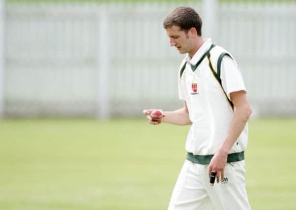 James Magowan getting ready to bowl for Lisburn against Waringstown. US1421-514cd Picture: Cliff Donaldson