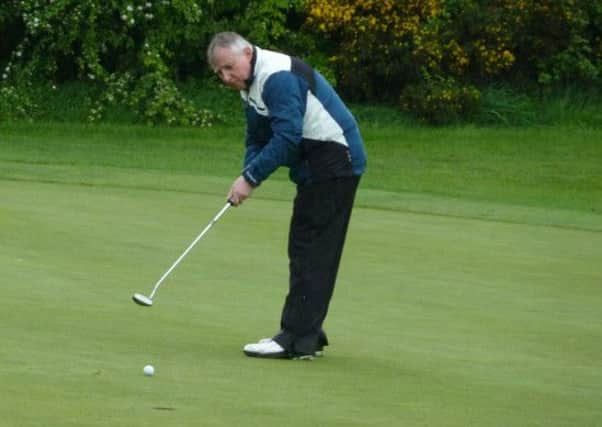 Making his debut for Rockmount Golf Club, Michael Harrison watches his putt very attentively at the fourth hole.