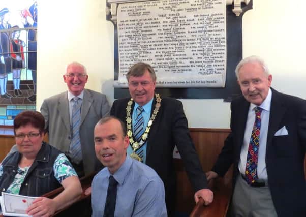 Pictured with Richard Wallace (back left) at the launch of his book Lest we Forget are Mayor Fraser Agnew, Sam Sloss (right), retired principal of Ballynure Primary School, Linda Dodds, church secretary of Ballynure Methodist and Alastair Black, clerk of session at Ballynure Presbyterian. INNT 22-500CON