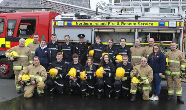 Members of Carnlough and Cushendall Fireservice with Group Commander Archie McKay at the Cadet Passing out parade
