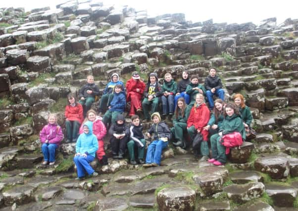 This group of Primary Six and Seven pupils from Culmore Primary didnt let the rain bother them during their recent trip to the spectacular Giants Causeway.