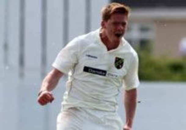 Craig Young celebrates taking another wicket for North West Warriors against Leinster Lightning.