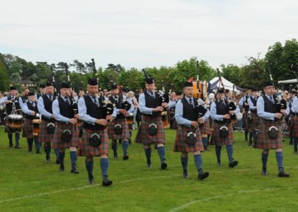 Pipe Major Glenn Cupples (left) and Cullybackey Pipe Band entering the competition arena at the Borough of Ards Pipe Band and Drum Major Championships in Newtownards.