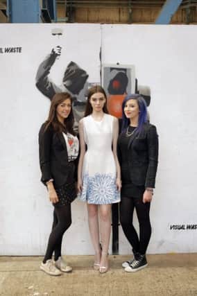 This yearâ¬"s University of Ulster graduates from Belfast School of Art Orla Fitzsimons & Amy Caughey from Ballymena, pictured with model Lauryn Greer ahead of the UU Graduate Fashion Show at T13 on 29th May