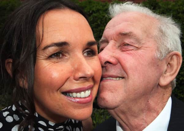 Daddy's girl: Councillor Stephanie Quigley of the SDLP gets a peck from her dad Gerry McLaughlin. PICTURE MARK JAMIESON. INCR22-504mj