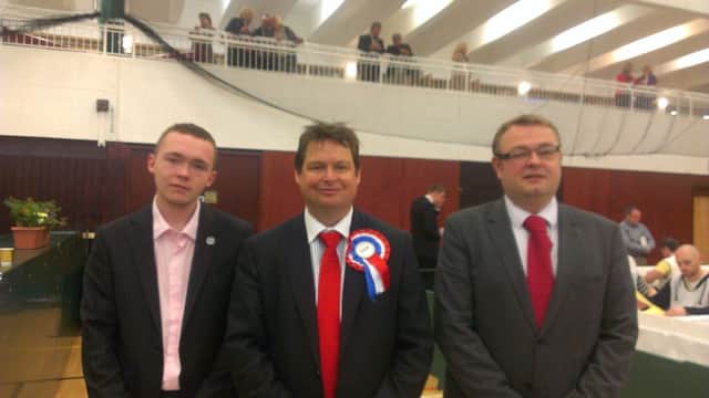 Mark Cosgrove (centre) pictured with party member Andrew Moran (left) and Agent Robert Foster (right). INNT-22-704-cosgrove