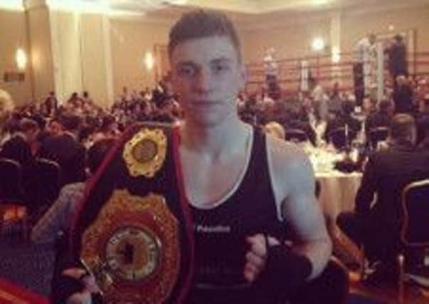Anthony O'Rawe with the belt he won on his recent US trip.
