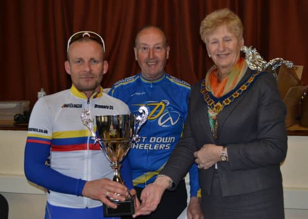 Gavin Magowan (Dromara CC), winner of the senior event, receiving his trophy from Chairperson of Banbridge District Council, Councillor Olive Mercer. Also pictured is chairman of the West Down Wheelers, Billy Maxwell.