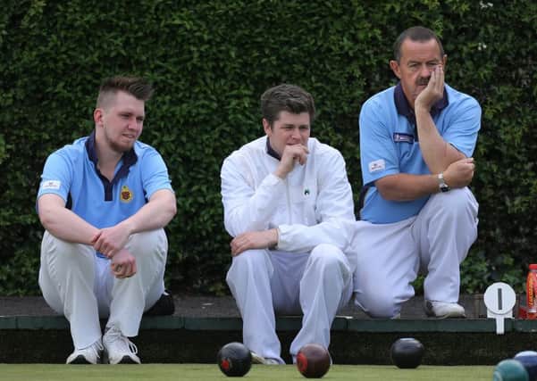 Michael Wilson, David Duncan and Jimmy Hodges don't appear too animated as the watch a head develop during Saturday's Irish Senior Cup game with Ballywalter. INBT-22-163CS