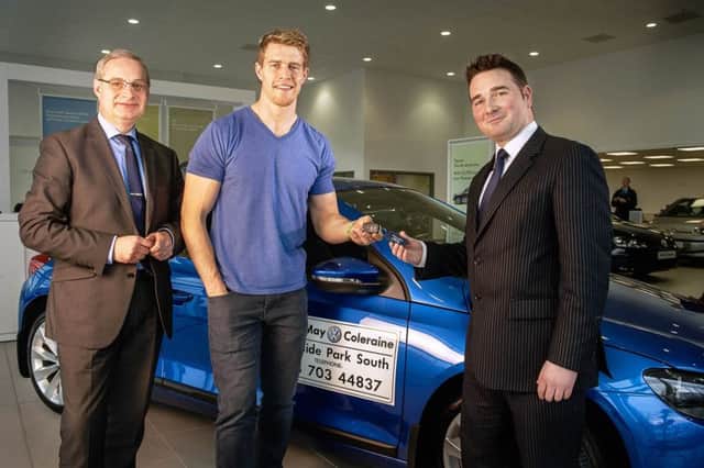 Ulster and Ireland  Rugby Star Andrew Trimble receives a VW Scirocco at Edwin May Volkswagen Dealership Coleraine.