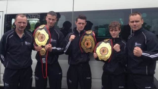 Paul Donnelly Snr, Paul Donnelly Jnr, Brian McAlister, Lewis Napier and 'Spike' Martin proudly show off the belts they won in Washington DC.