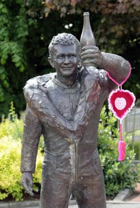 TRUST. Children's Heartbeat Trust NI, launched their 'Wear Your Heart On Your Sleeve' campaign whereby they don a knitted heart on famous statues in each NI county to promote their cause. And for County Antrim the statues of both Joey and Robert were selected by the charity.INBM22-14 024SC.