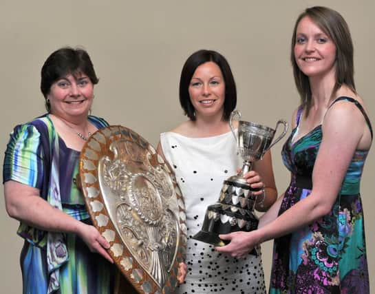 Mandatory Credit: Rowland White/Presseye
Women's Hockey: Ballymoney
Date: 30th April 2011
Caption: Team Manager Liz Lamont, Bridget Cleland and Susie Martin with the Ulster Shield and Premiership League Trophy at their Annual Dinner
