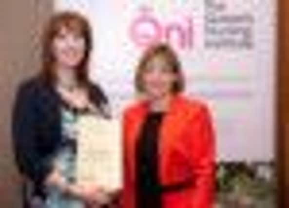 Sadie Campbell pictured receiving her award from Jane Cummings, Chief Nursing Officer, England.