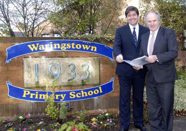Happy To report...Waringstown Primary School principal, Mr Gary Kennedy, right and vice principal Mr Carl McCambley with the school's recent inspection report. INLM42-210.