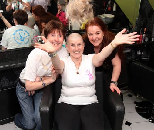 Rita Moore after her head shave at Gingersnips for the Boom Foundation. Included are; Jill Marrs, Rita's friend who is suffering from the cancer and why Rita had her head shaved to raise funds, and Lesley-Ann McNeill from Gingersnips. INCR22-347PL