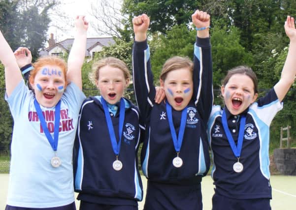 Dromore P3 girls celebrate with their silver medals after the Ferris Park tournament.