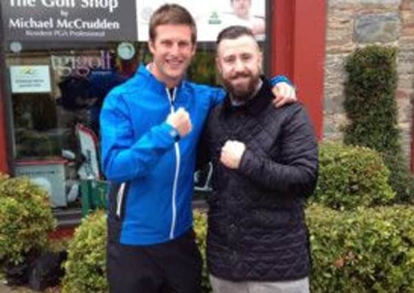Boxer Paul McCloskey with Roe Park resident PGA Professional Michael McCrudden.