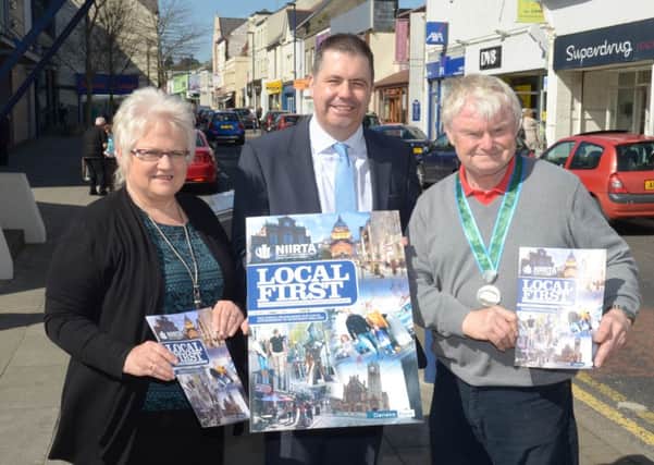 Glyn Roberts, Chief Executive of the Northern Ireland Independent Retail Trade Association, pictured with Mariann Casagrande and John Shannon (Chairman) of the Larne Traders' Forum launching the Local First campaign in Larne. INLT 17-369-PR