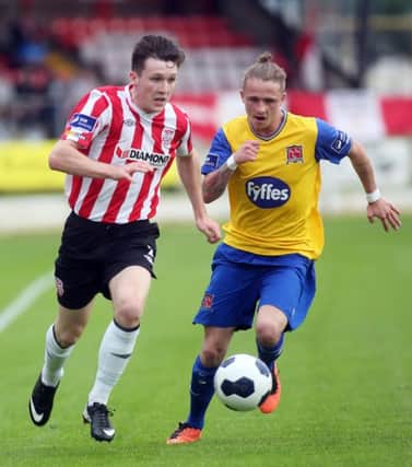 Roddy Collins Jr., pictured with Dundalk's Mark Griffin last Tuesday night, appears to have played his last game for Derry City.