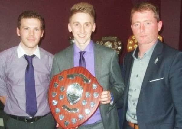 Lurgan BBOB Young Player of Year Andrew Smyth and youth coach Matty Greer with Darren Murphy.