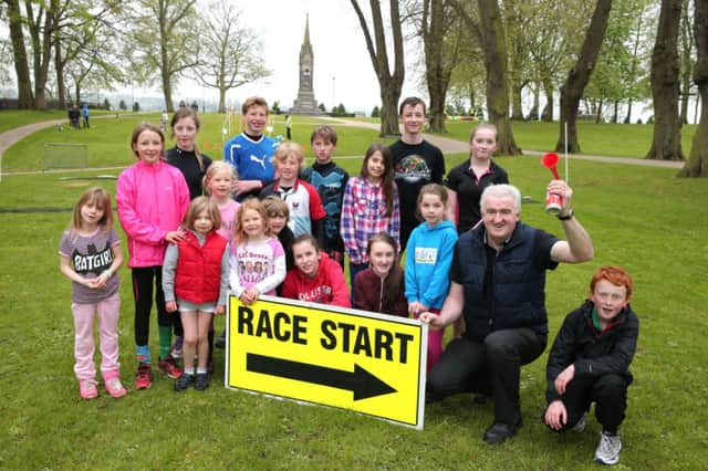 Councillor Alan Carlisle, Vice-Chair of the Council's Leisure Services Committee is pictured with some of the young people who took part in the 'Obstacle Challenge' event in Castle Gardens.