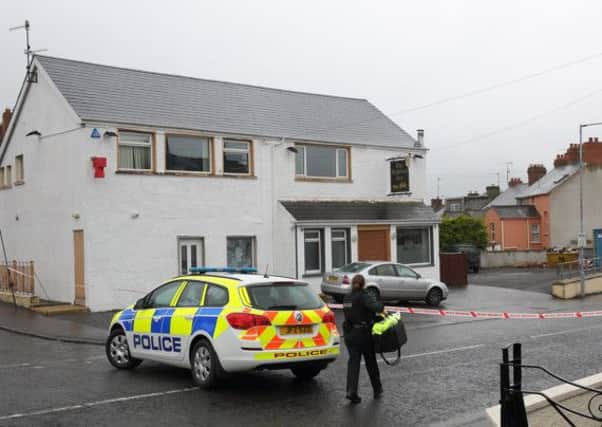 Police seal off the Highway Inn, Hillhall Road, after staff reported a suspicious package in a silver car parked outside. Picture: Cliff Donaldson