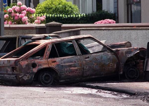 The bullet and burnt out car in which three IRA men were shot dead by the SAS in Coagh in 1991.