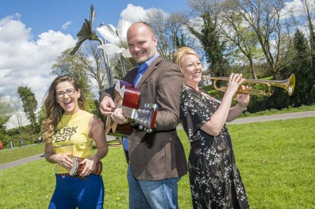 Banbridge District Council's Nicola Armstrong (right) joins Emma Curran and Ralph McLean (BuskFest judge) to launch BuskFest 2014, which takes place in Banbridge on Saturday 21 June with a £3,000 prize pot. Buskers can register now at www.buskfest.com .