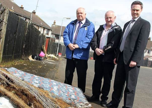 Councillor Reuben Glover, Alderman Martin Clarke and Paul Frew, DUP MLA see the fly tipping problem in Ballykeel 2 for themselves during a visit last week to the estate.